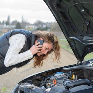 What extraordinary safety measures should I employ if my automobile breaks down in severe weather?