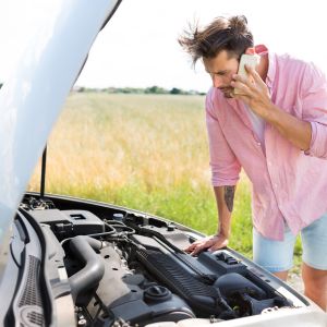 What steps can I take to minimize safety risks if my car breaks down on the road